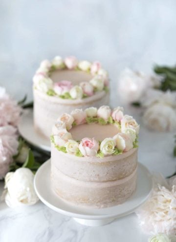 photo of two Smash Cakes on a table with flowers