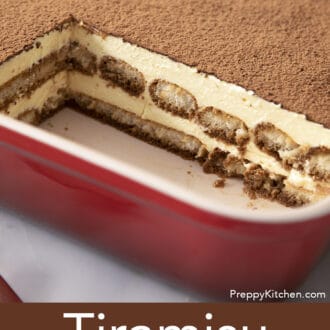A baking dish of tiramisu with several pieces removed.