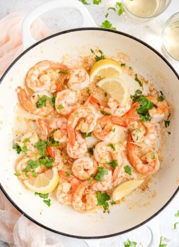 An overhead shot of sauteed shrimp in a large pan