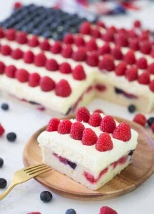 An American flag cake made with berries on a marble table