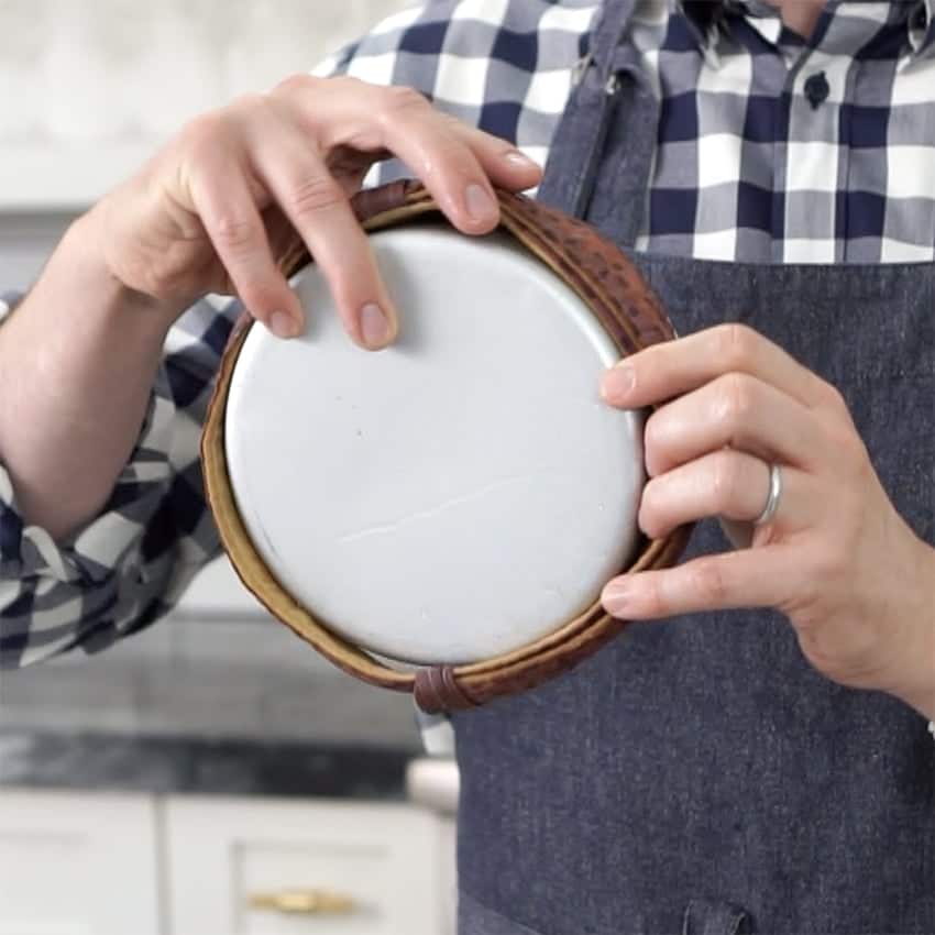 Photo showing Cake strips being applies to a pan