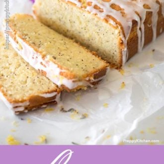 A cut lemon pound cake with white icing and lemons in the background