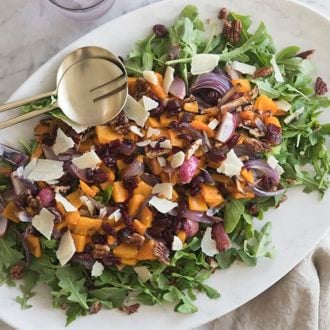 A photo of salad with roasted squash and onions