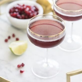 photo of a pomegranate martini on a marble tray