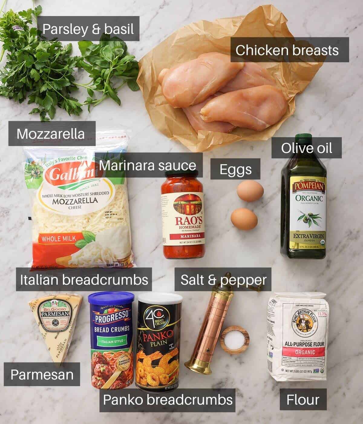 An overhead shot of all the ingredients you need make chicken parmesan