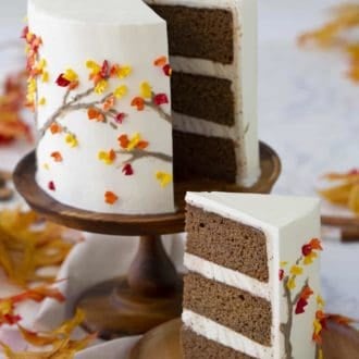 three layered spice cake on a wooden cake stand