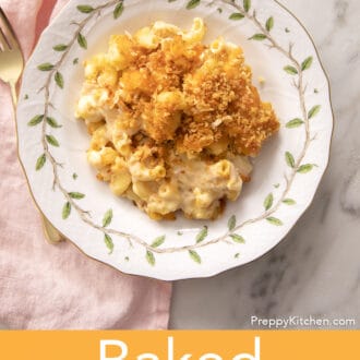 Baked mac and cheese with toasted breadcrumbs on a white plate.