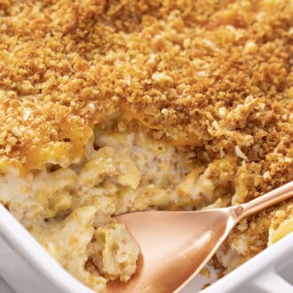 A white dish with baked mac and cheese.
