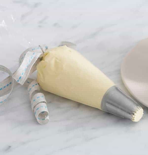 A photo of french buttercream in a piping bag.