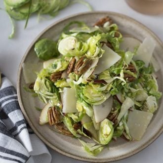 A photo of a shaved Brussel sprouts salad.