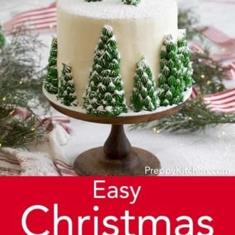 christmas cake with christmas tree decoration topped in powdered sugar