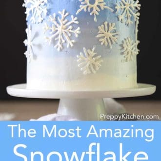 snowflake layer cake on a stand