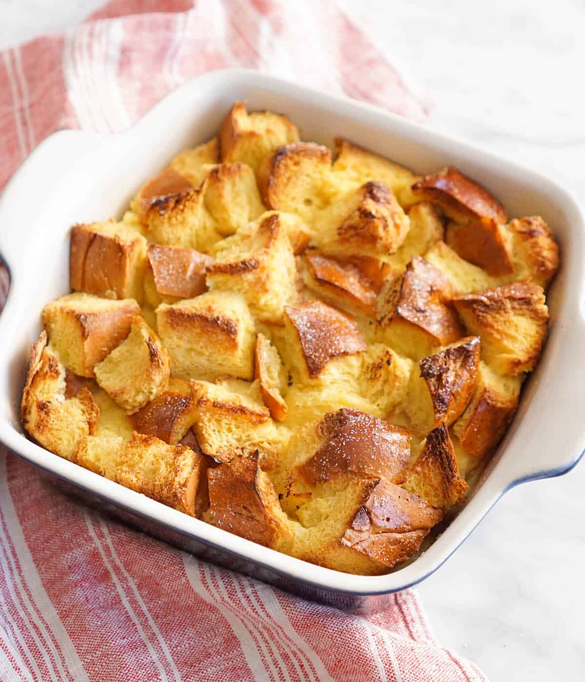 A dish of bread pudding after being baked.
