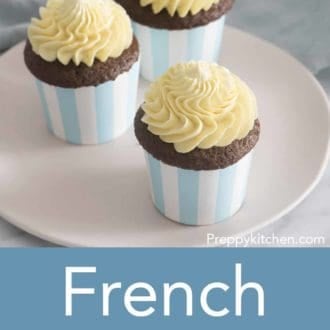 cupcakes with french buttercream frosting sitting on a plate