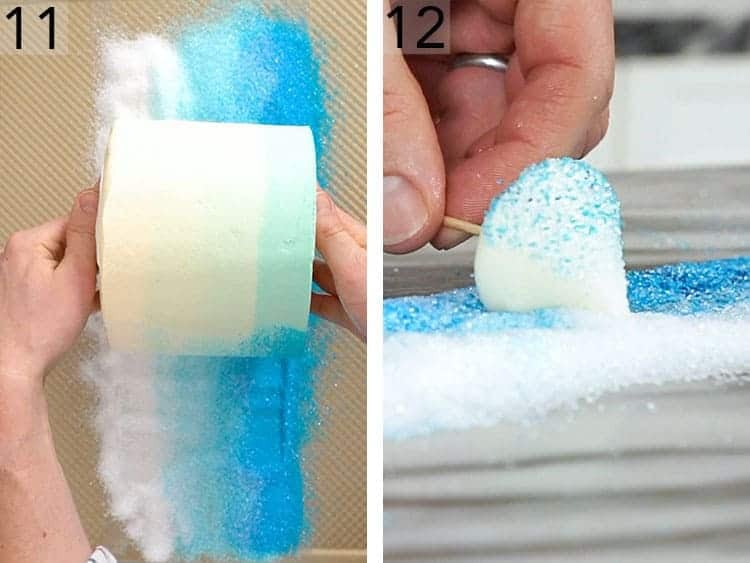 A winter wonderland cake being rolled in an ombre of sanding sugar.