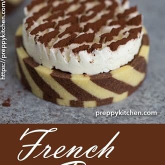 A clipping showing a french pastry with a Swiss meringue topping dusted with cocoa powder.