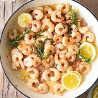 A photo of garlic shrimp with crispy pancetta.