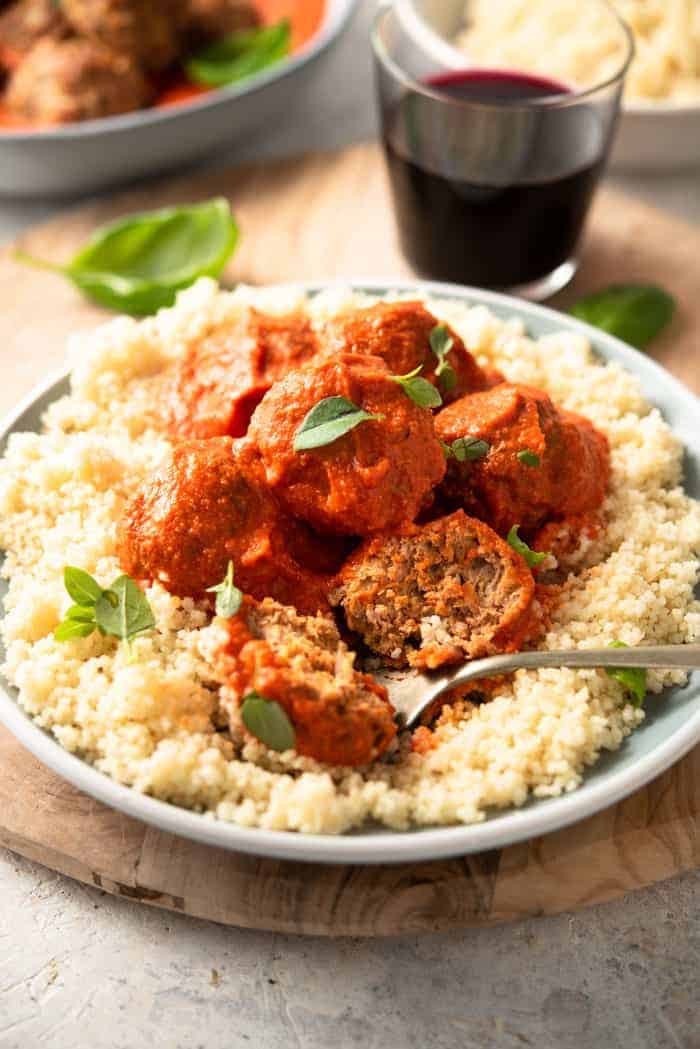 A plate of turkey meatballs on a bed of couscous