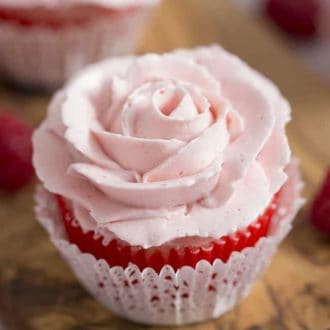 A close up of a Valentines day rose cupcake.