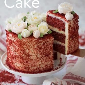 three layer red velvet cake with cream cheese frosting on a cake stand