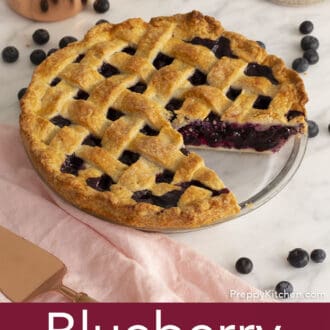 blueberry pie on counter with pink napkin