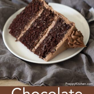 piece of three layered chocolate cake with chocolate frosting