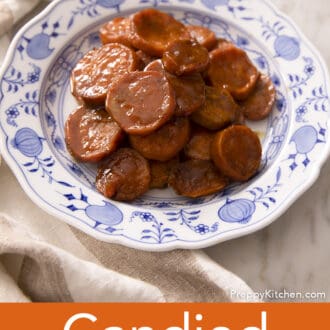 Pinterest graphic of candied yams on a blue and white plate.