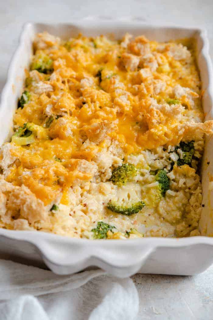 Side shot of a broccoli casserole with a spoonful missing