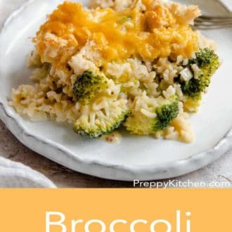 broccoli casserole on a white plate with a fork