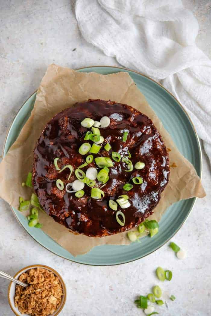 An overhead shot of an instant pot meatloaf topped with scallions