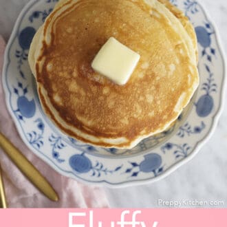 stack of fluffy pancakes on a plate with butter