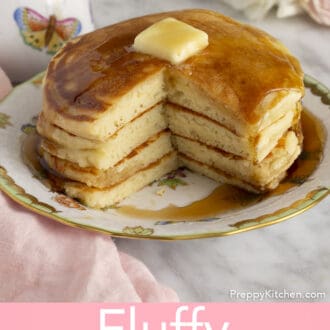stack of fluffy pancakes on a plate with syrup