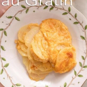 A pinterest graphic of a plate of potatoes au gratin.