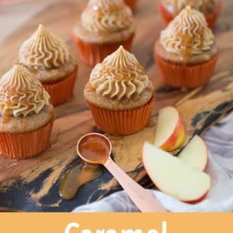 Pinterest graphic of multiple caramel apple cupcakes on a wooden board with apple slices and some caramel on the side.