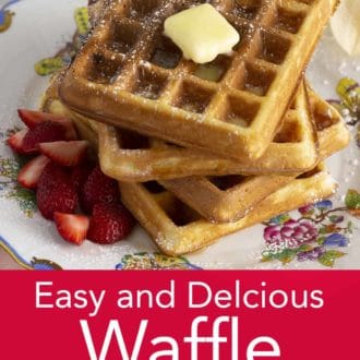 stack of waffles on a plate topped with butter