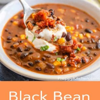 black bean soup in a white bowl with a spoon
