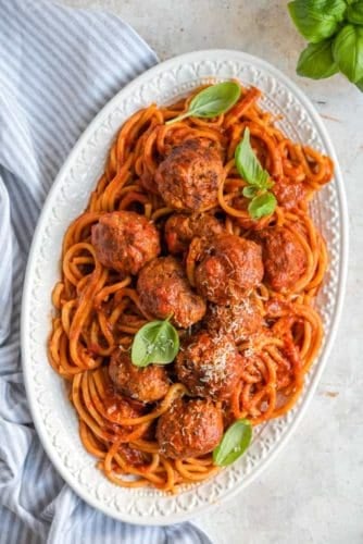An overhead shot of instant pot spaghetti and meatballs on a white serving platter.