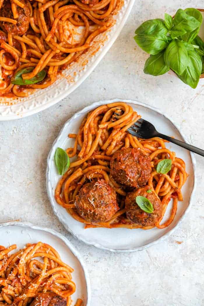 An overhead shot of instant pot spaghetti and meatballs on plates