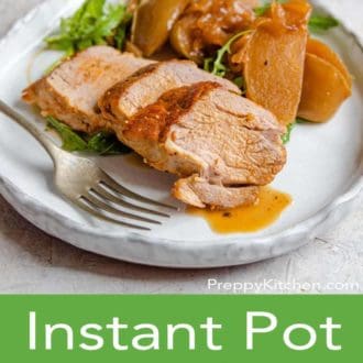 instant pot pork tenderloin on a white plate with a fork