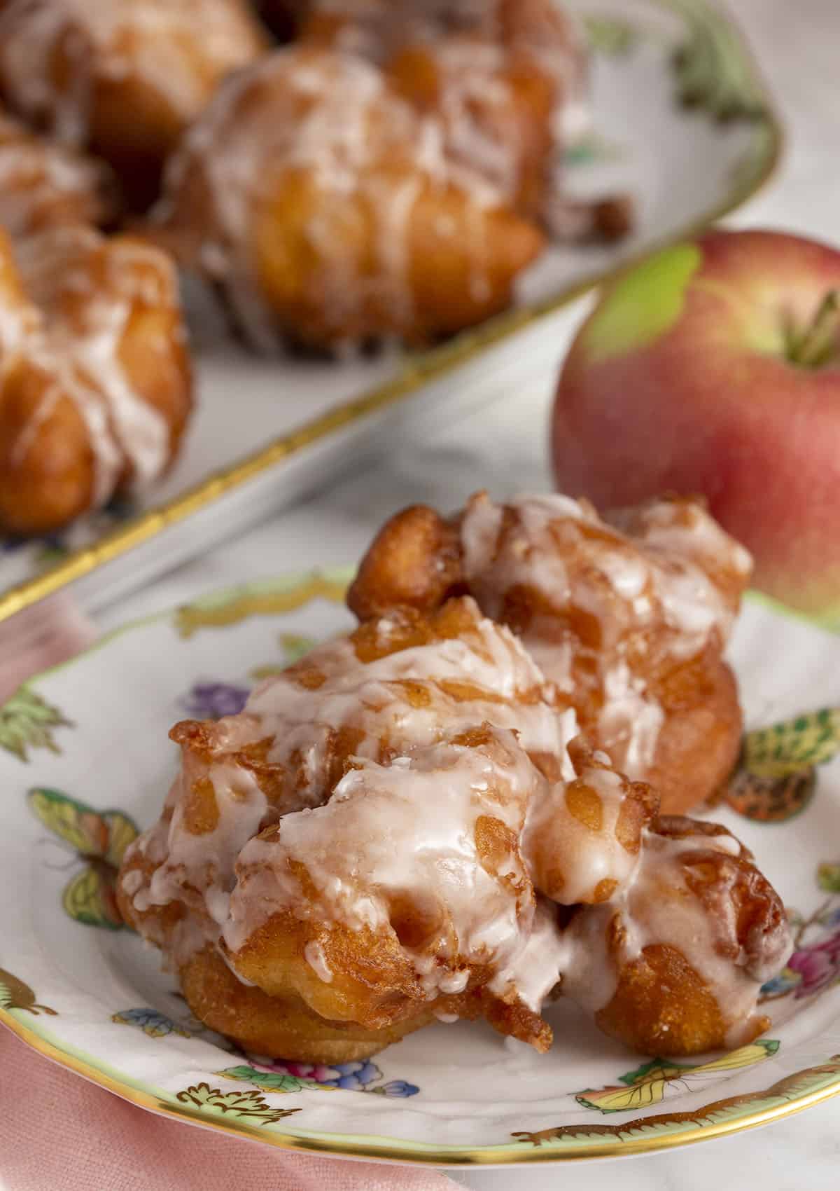 Apple fritters on a plate.