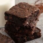 A close up of brownies stacked on top of each other