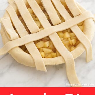 An apple pie's lattice top getting assembled.