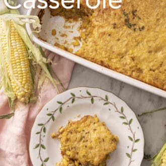 Corn casserole on a marble counter with corn.