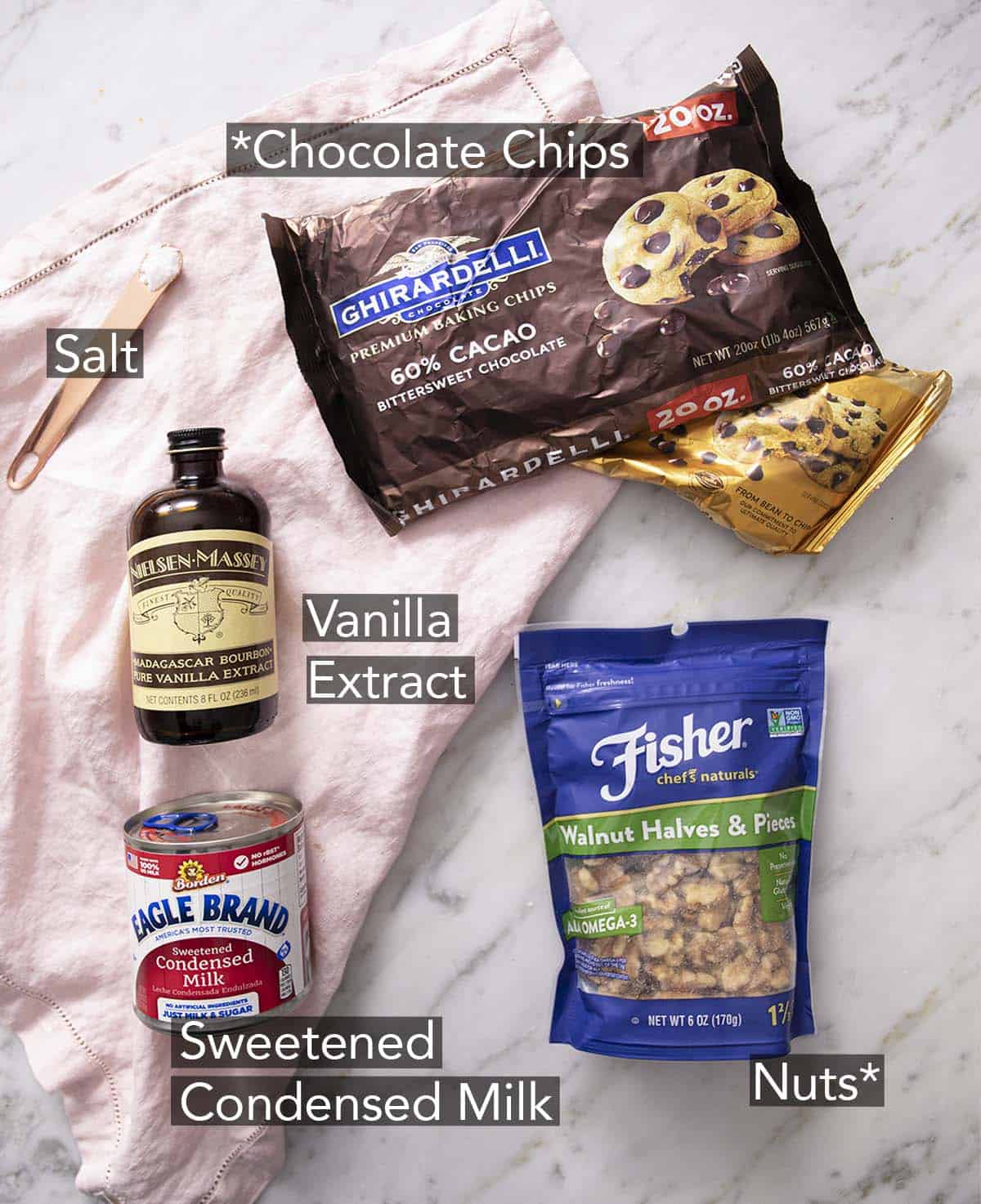 Ingredients to make fudge laying on a marble counter.