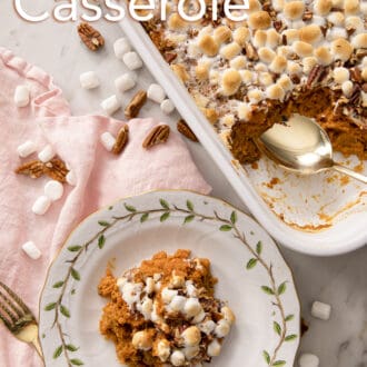 A Sweet Potato Casserole topped with marshmallows on a white plate.