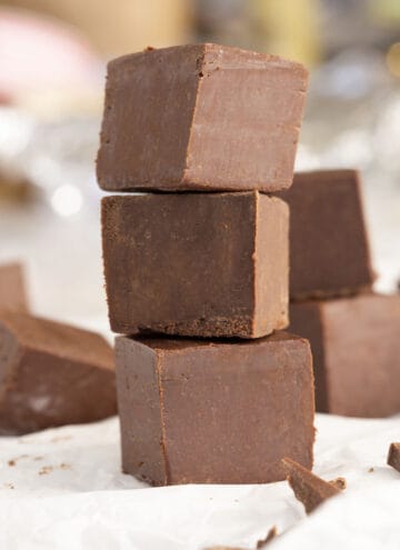 Three cubes of chocolate fudge stacked vertically.