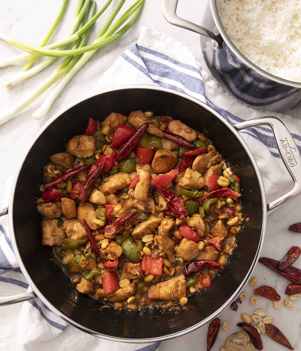 An overhead shot of kung pao chicken in a skillet