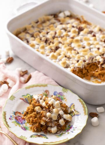 A sweet potato casserole topped with marshmallows and pecans.