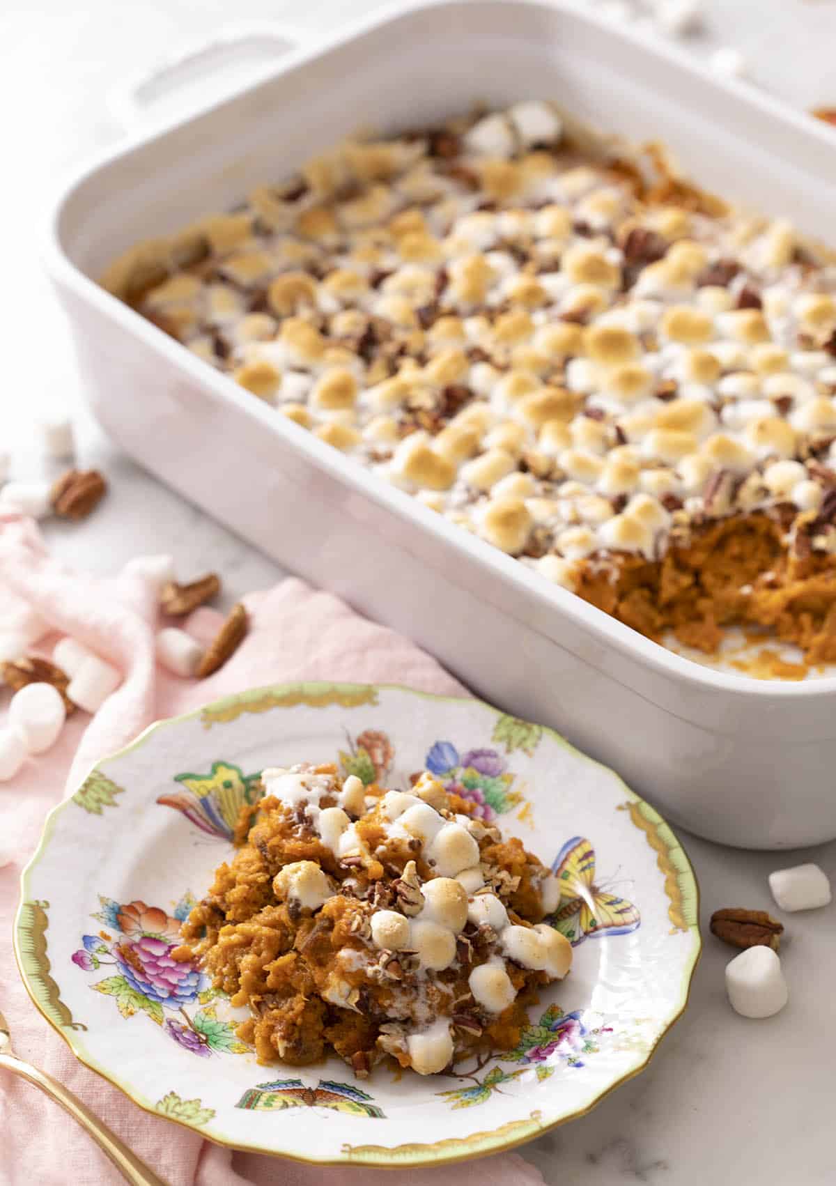 A sweet potato casserole topped with marshmallows and pecans.