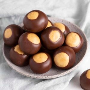 A small gray bowl full of buckeye candy.